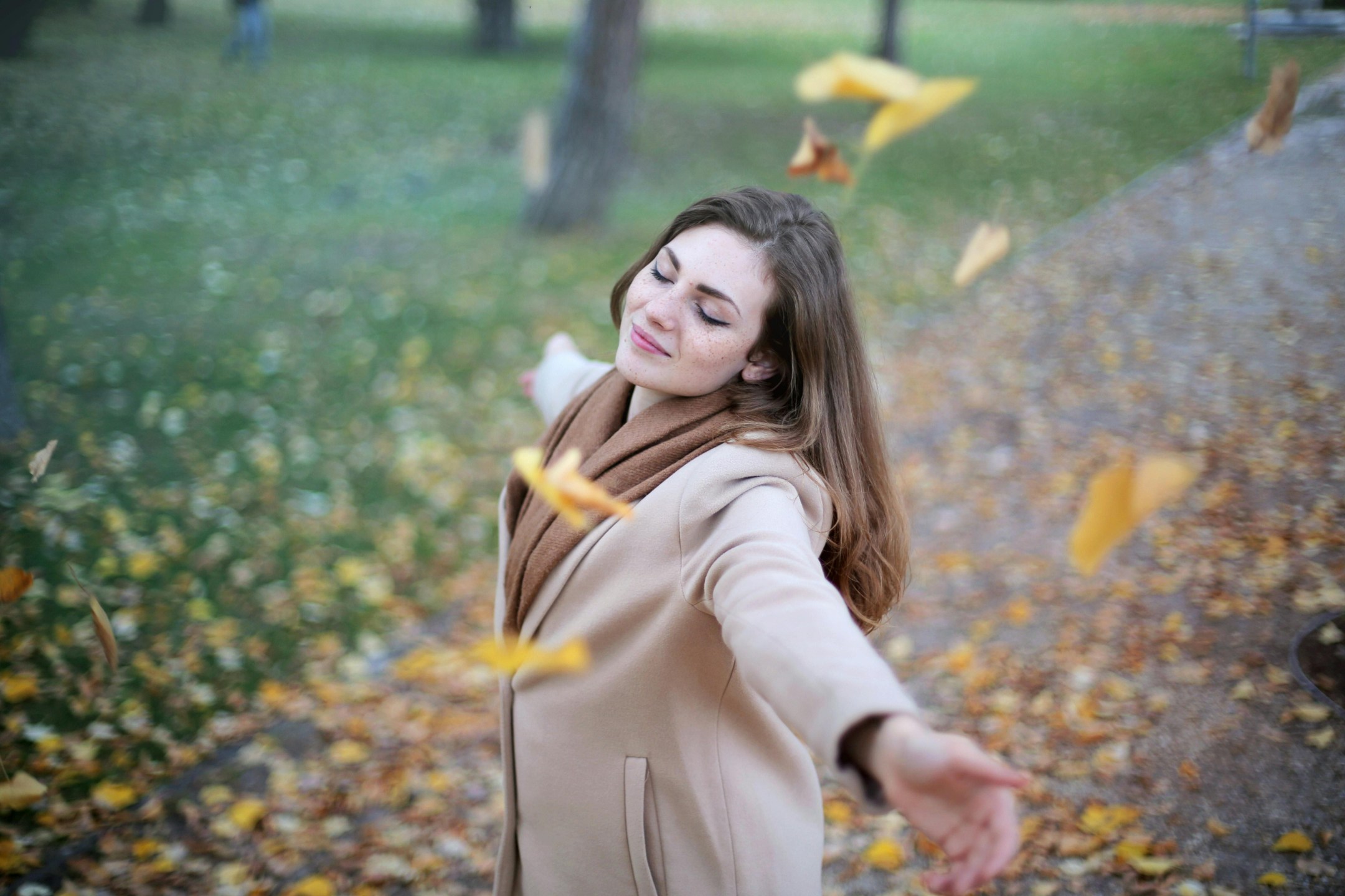 4b31ca7 86e7 a46a 7c47 385ad1814ff woman open arms while closed eyes smiling photo