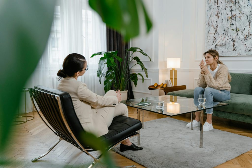 Therapist and client in session on opposite couches