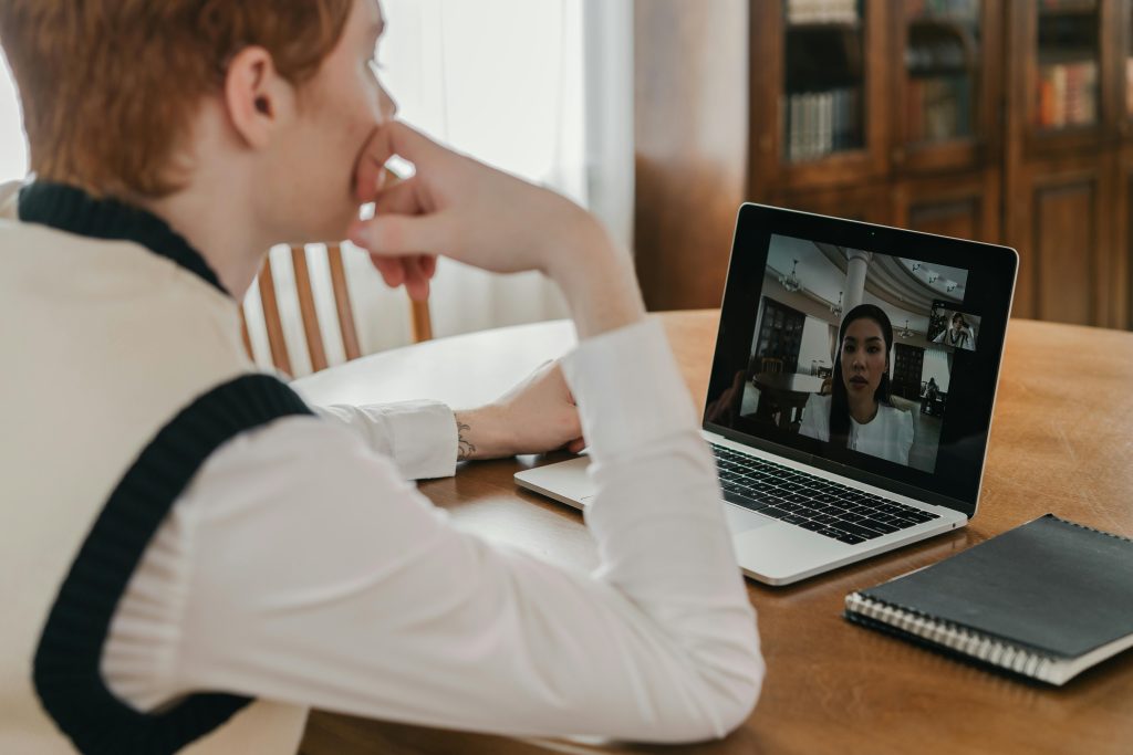 Person speaking with a therapist during an online video counselling session