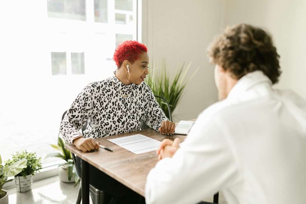 Therapist and client sitting across from each other during a counselling conversation